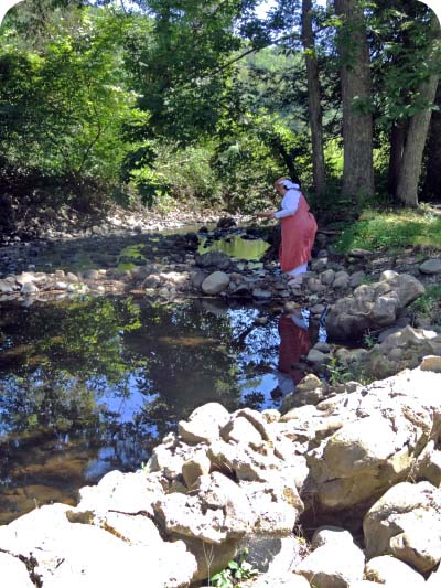Woman by stream